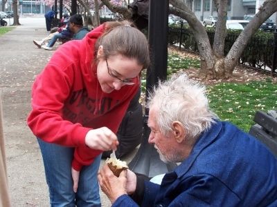 Teen helping homeless man