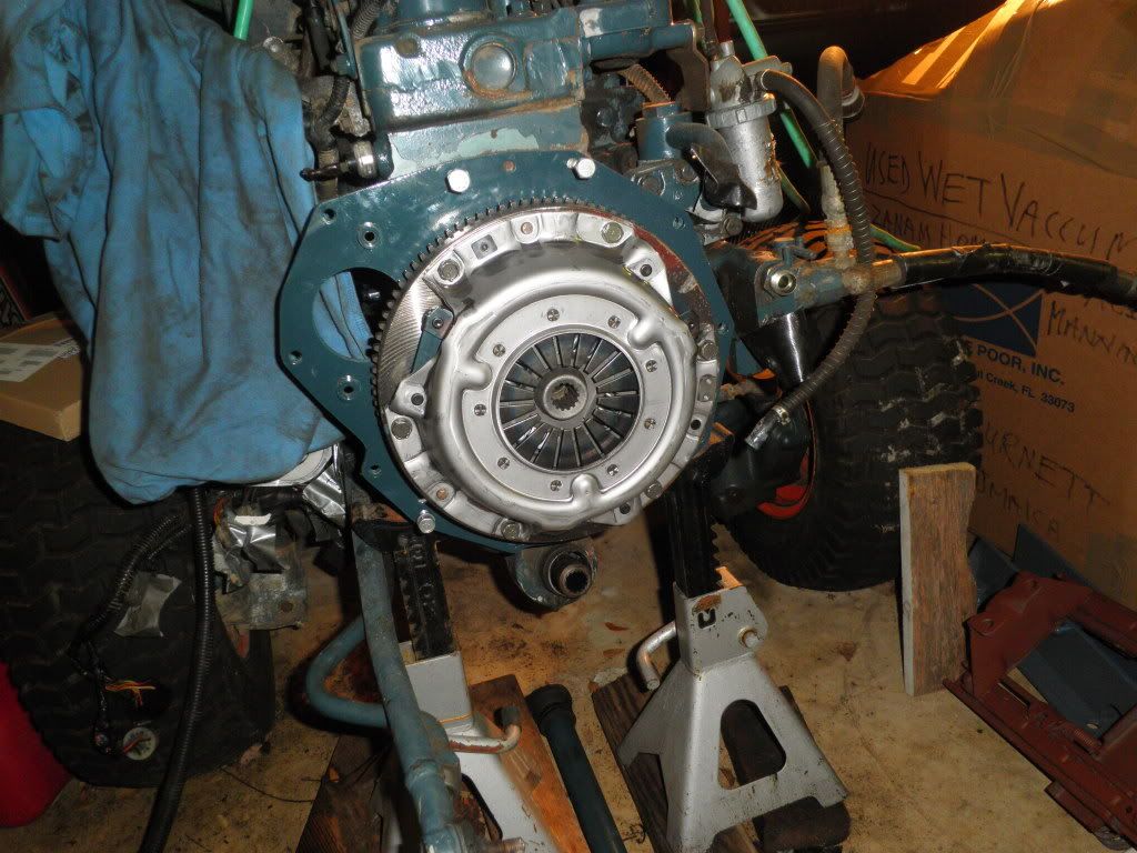 here is a quick shot of the other side and the new pressure plate/clutch/etc.
